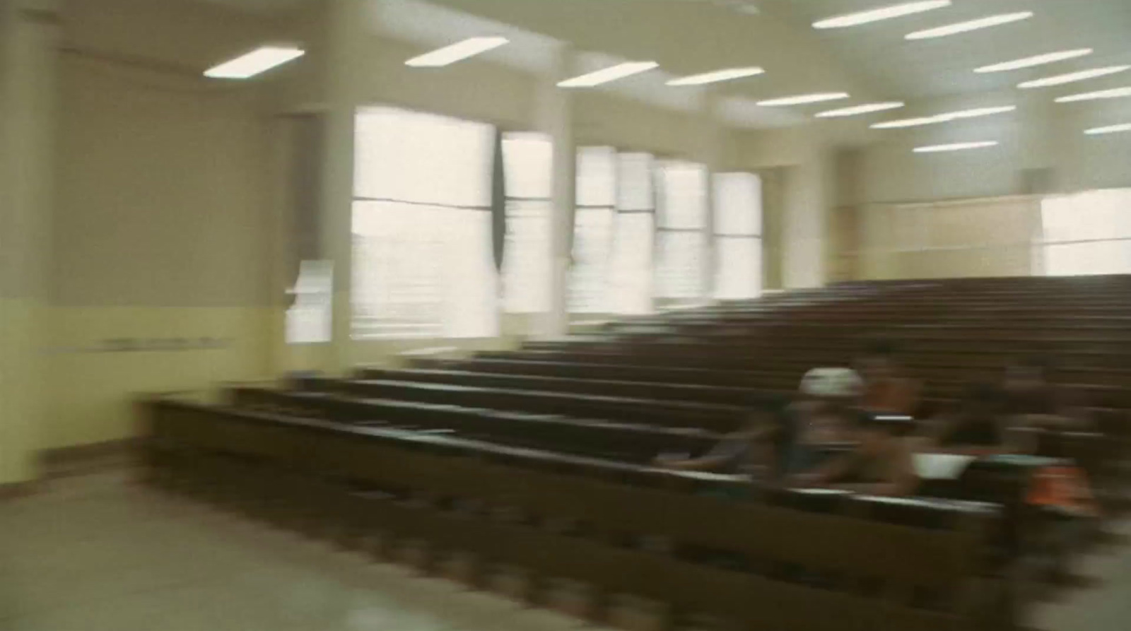 a blurry photo of people sitting in a church