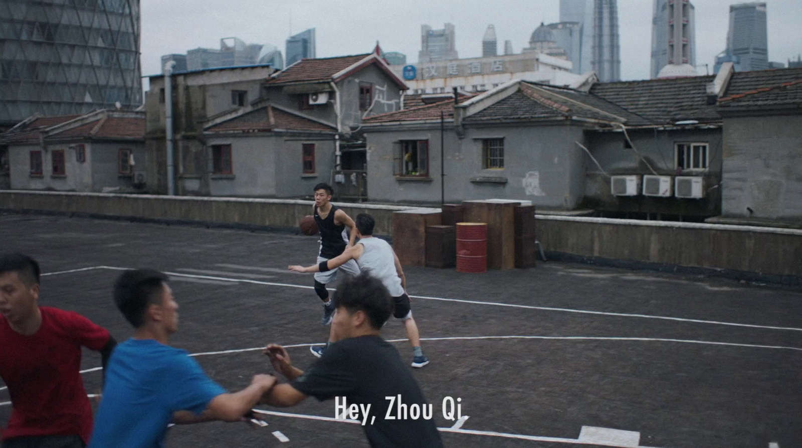 a group of young men playing a game of tennis