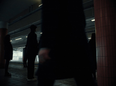 a group of people standing on a subway platform