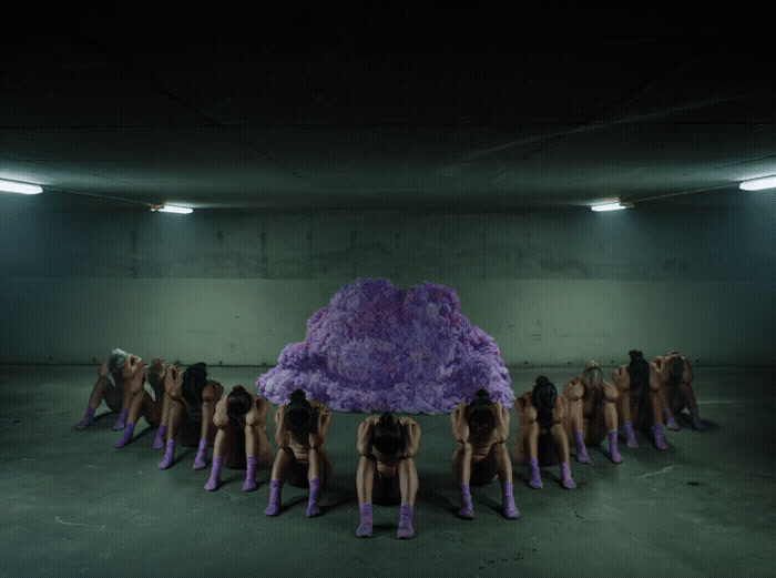 a group of naked women standing in a room