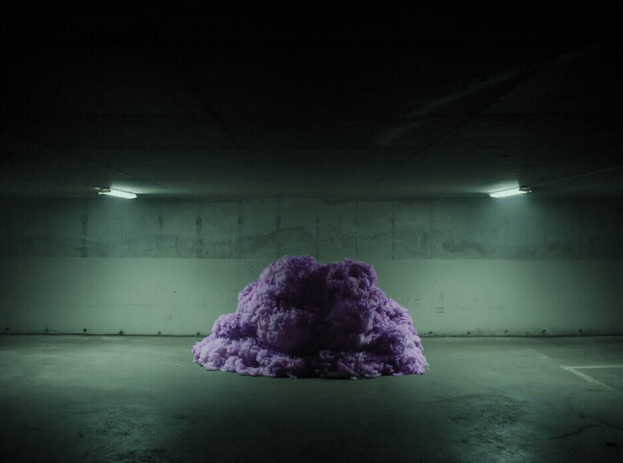 a large purple object in a dark room