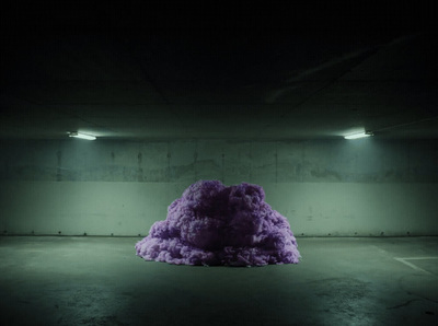 a large purple object in a dark room