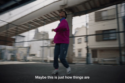 a woman in a pink jacket is running