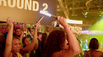 a group of people holding up signs at a party