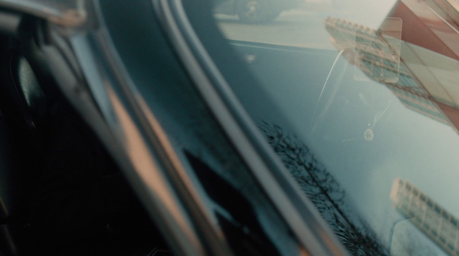 a close up of a car window with a stop sign