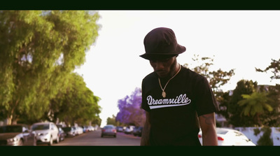 a man in a black hat and a black shirt