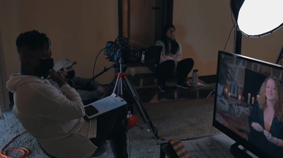 a man sitting in front of a laptop computer