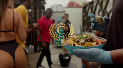 a person in blue gloves holding a bowl of food