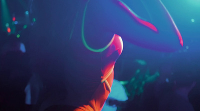 a woman in a red dress dancing at a party