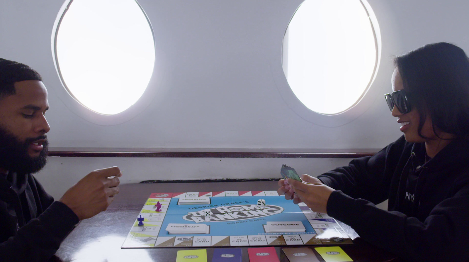 a man and a woman playing a board game