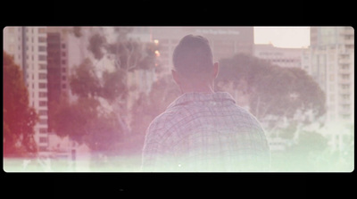 a man standing in front of a city skyline