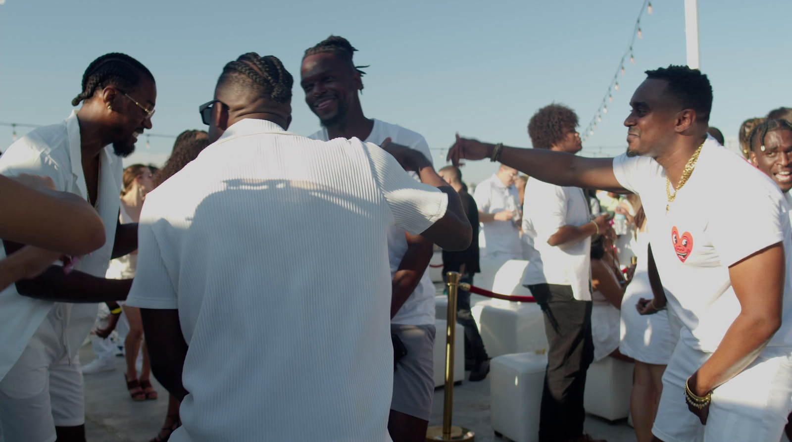 a group of men standing around each other