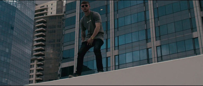 a man riding a skateboard on top of a building