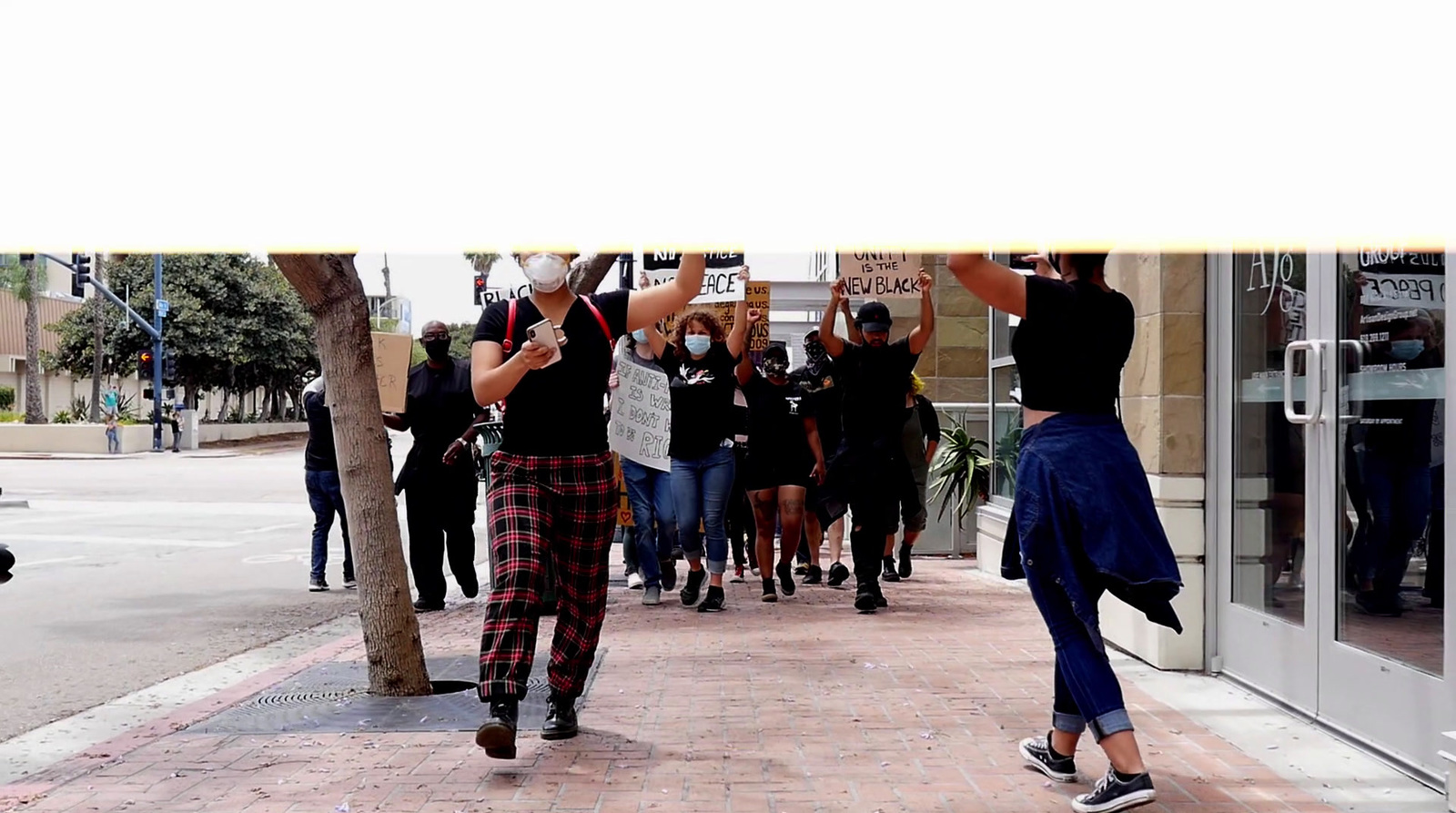 a group of people walking down a street