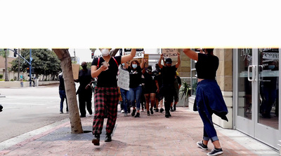 a group of people walking down a street