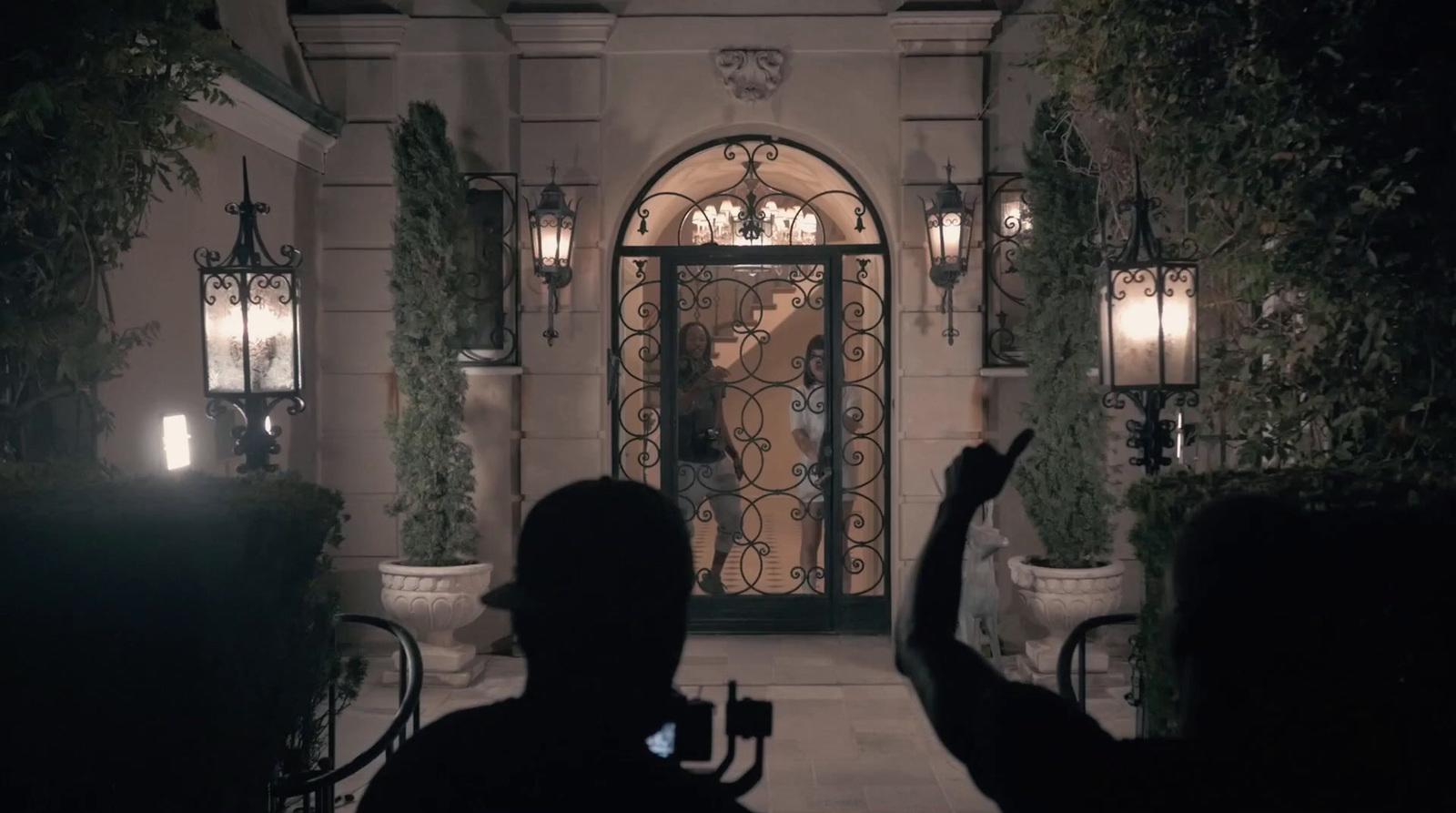 a man taking a picture of himself in front of a door