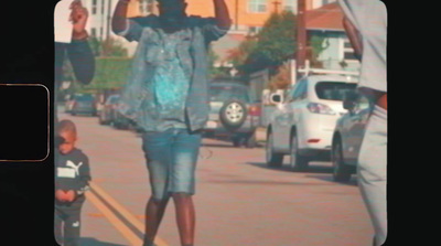 a woman and a child walking down a street