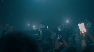 a group of people standing in front of a stage