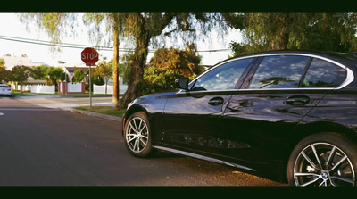 a black car parked on the side of the road