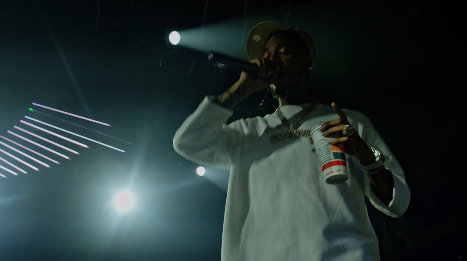 a man standing on a stage holding a microphone