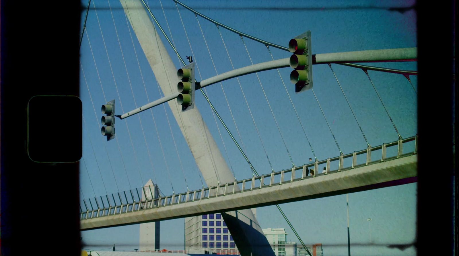 a view of a traffic light and a bridge