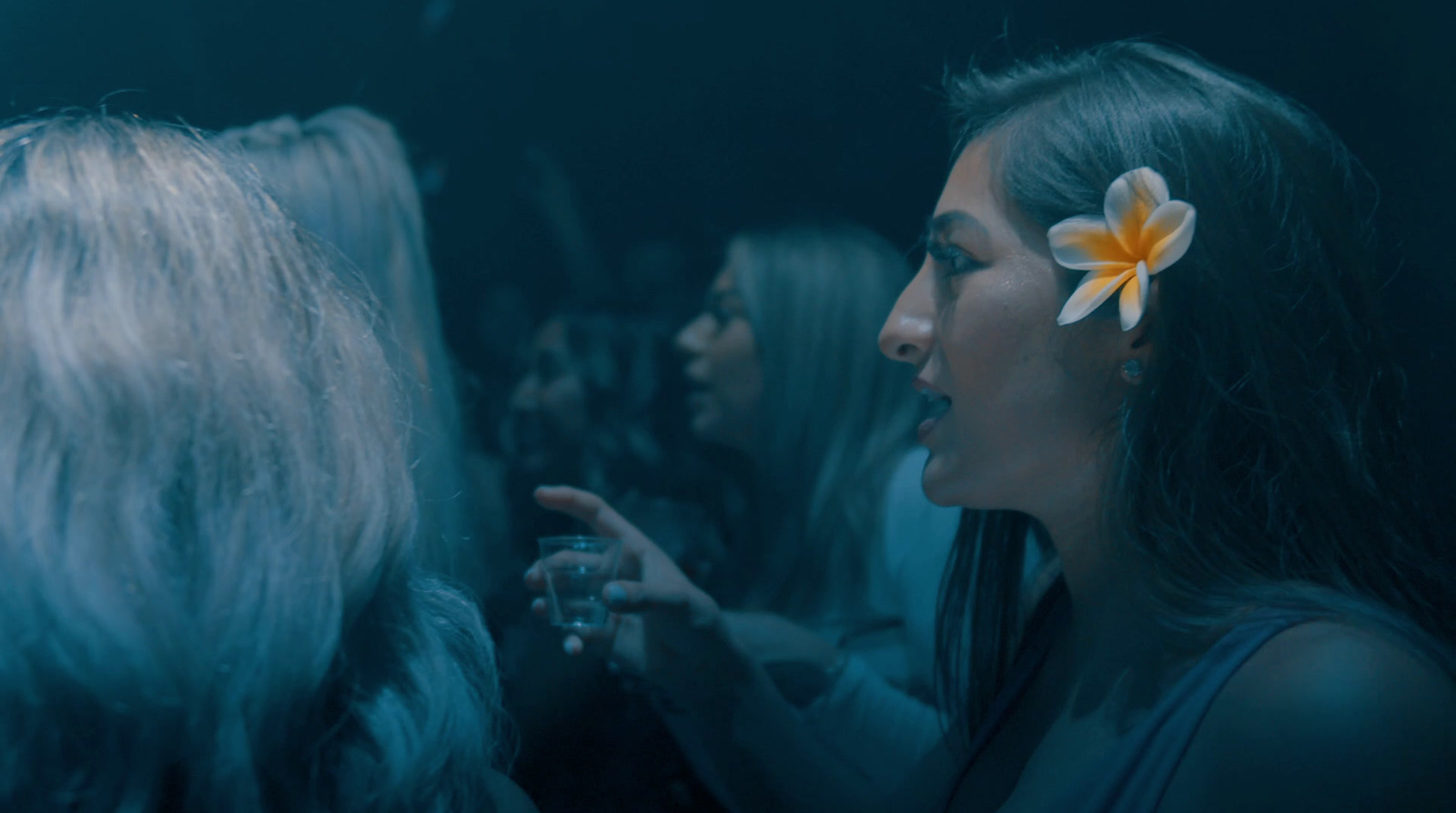 a woman with a flower in her hair