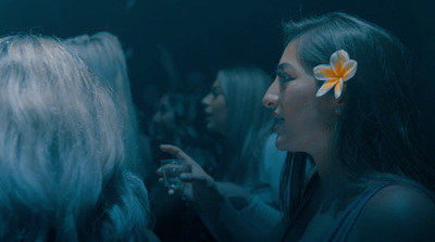 a woman with a flower in her hair