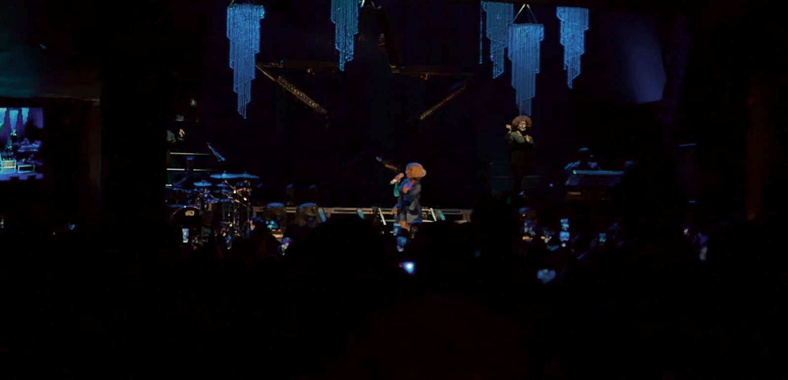 a group of people standing on top of a stage