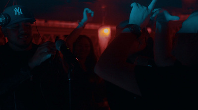 a group of people standing in a dark room