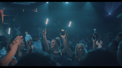 a group of people holding up their cell phones