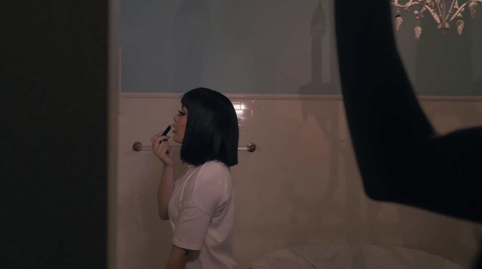 a woman brushing her teeth in a bathroom