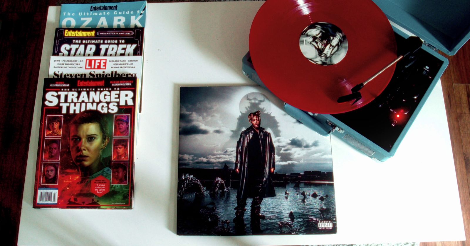 a record player and magazine on a table