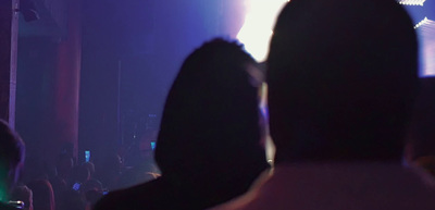 a group of people standing in front of a stage