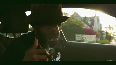 a man sitting in a car smoking a cigarette