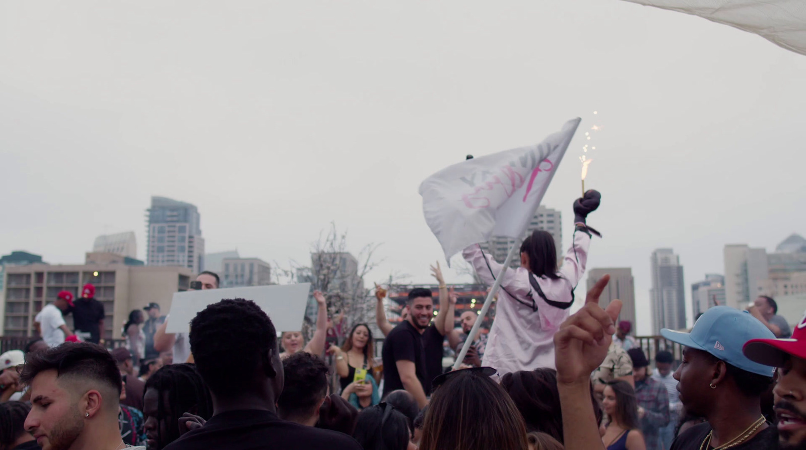 a group of people standing around each other