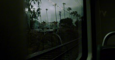 a view of a house from a train window