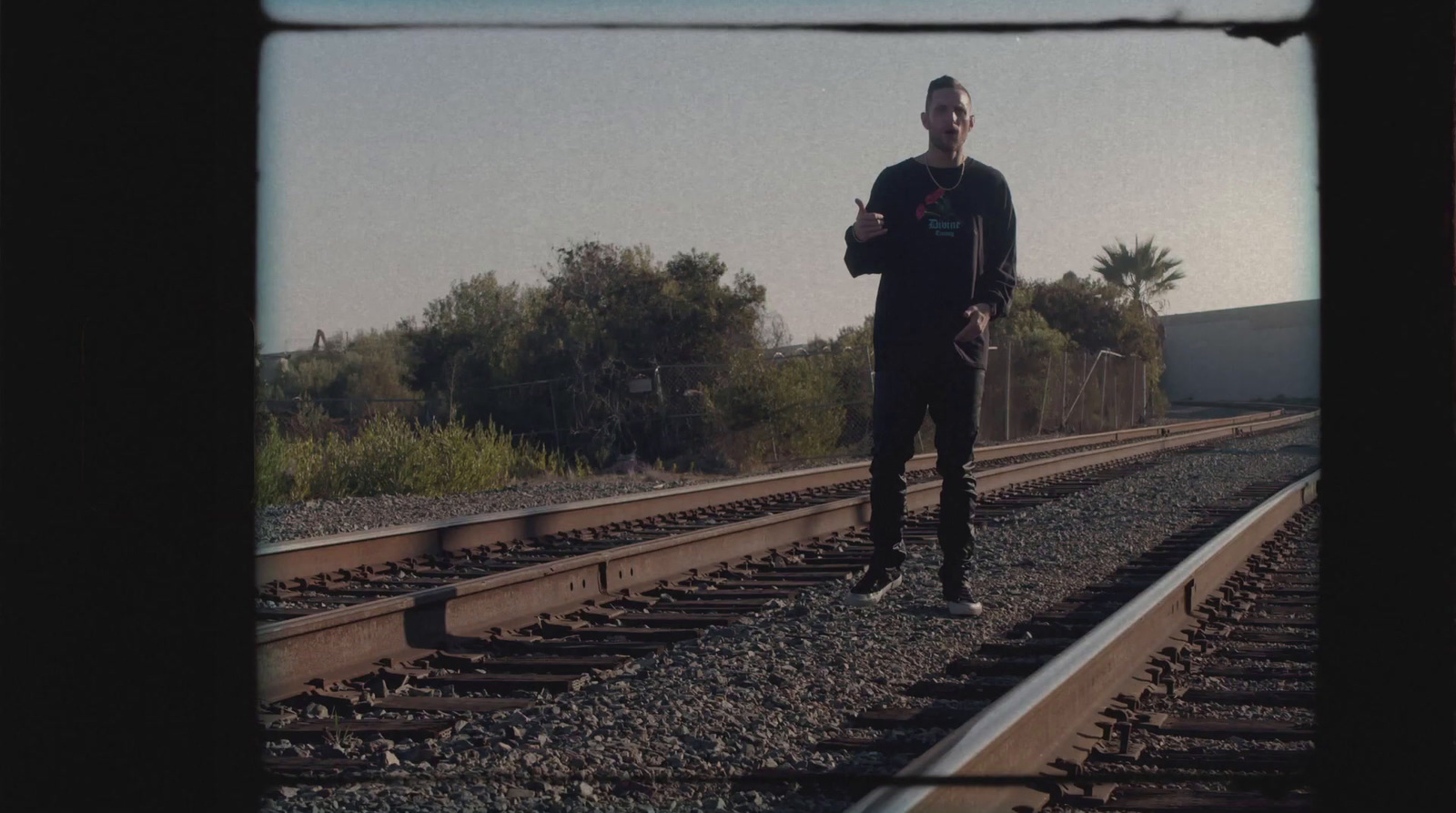 a man is standing on a train track