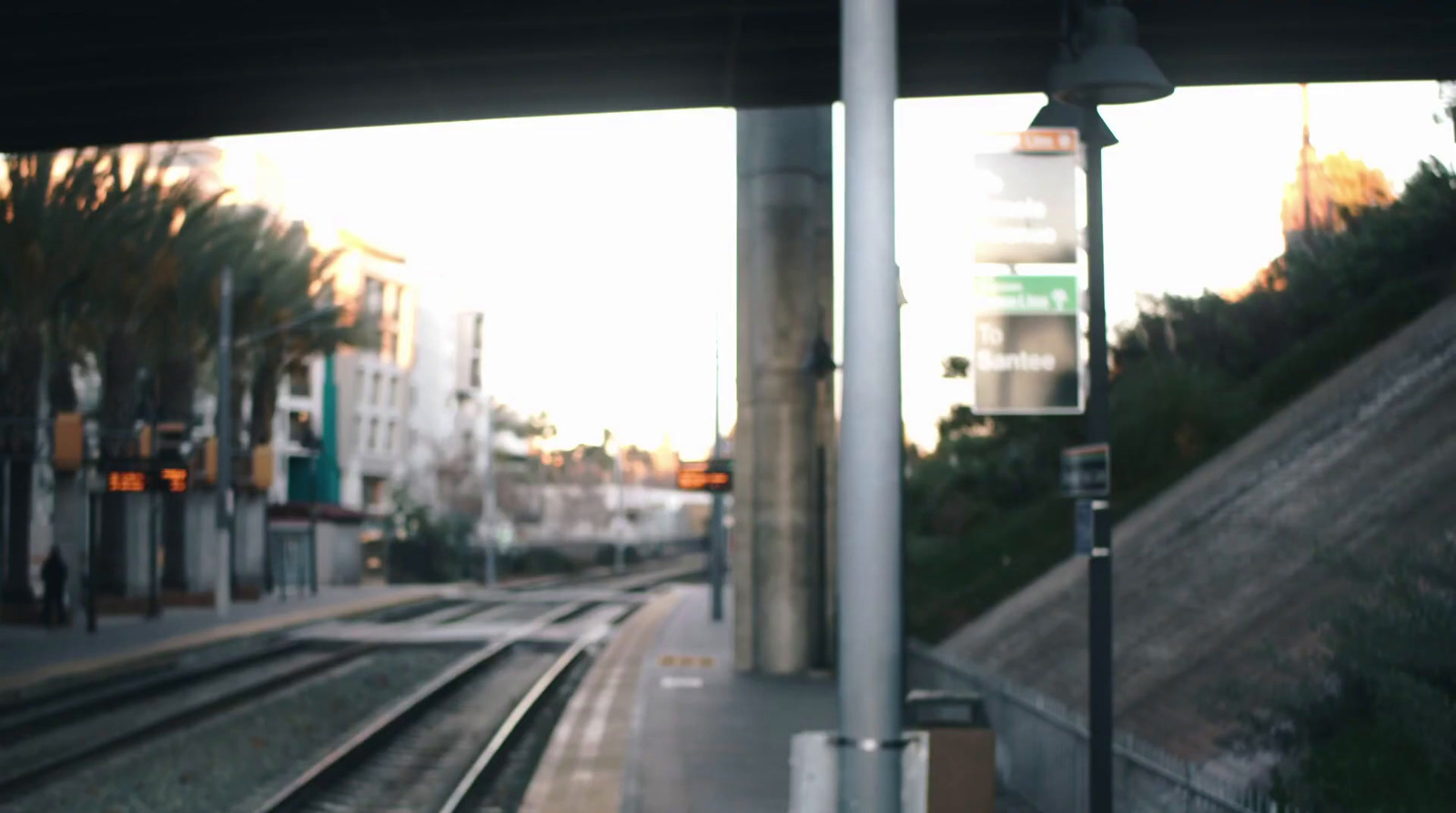 a train station with a train on the tracks