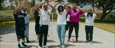 a group of young men standing on top of a basketball court