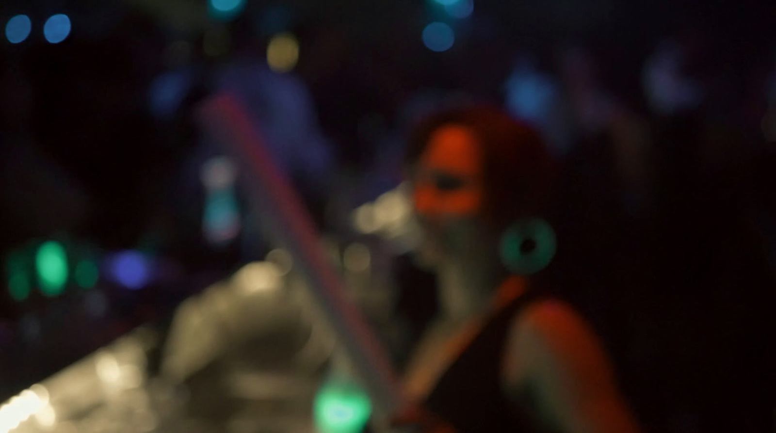 a blurry photo of a woman holding a cell phone