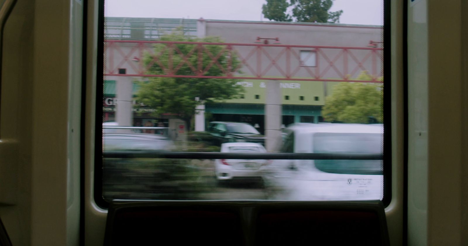 a view of a street from a train window