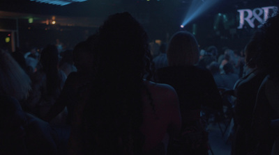 a group of people standing in a dark room