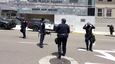 a group of police officers walking across a street