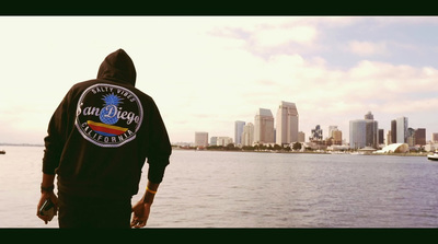 a man standing in front of a body of water