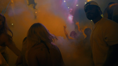 a group of people standing around in a room