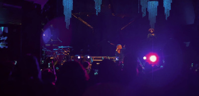 a group of people that are standing on a stage