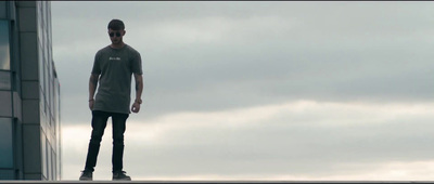 a man standing on top of a tall building