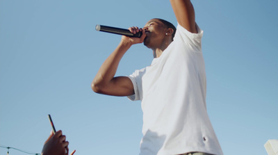 a man holding a microphone up to his mouth