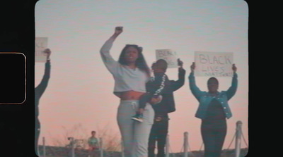 a group of people holding up signs in the air