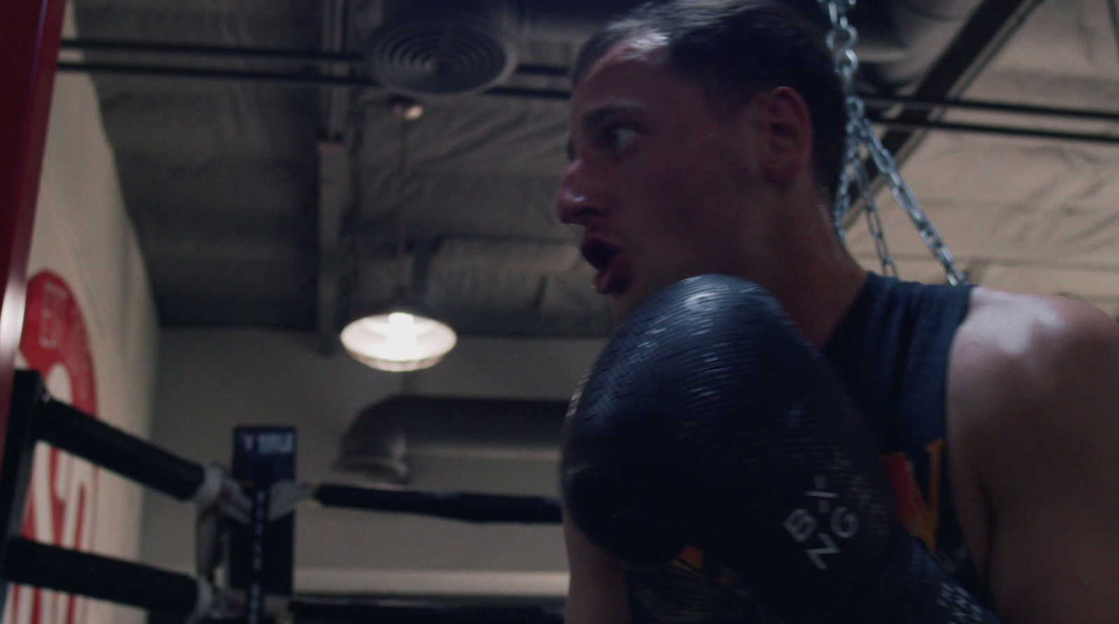 a man in a boxing ring with his mouth open